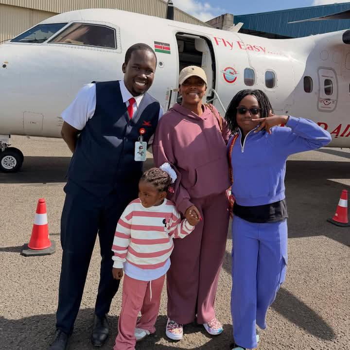 Skyward Airlines passengers beside an aircraft